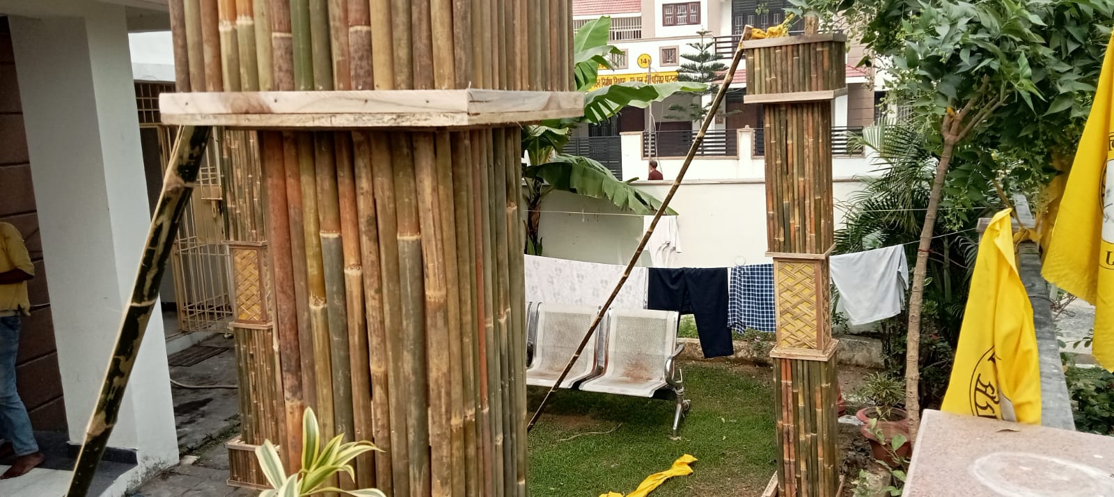 Bamboo planter railing being installed on the boundary wall, L-shaped corner view