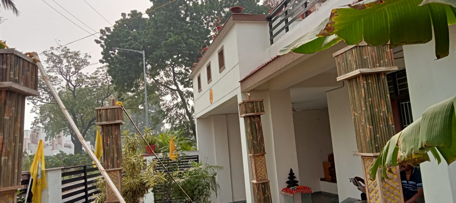 Bamboo planter modules with lattice jali panels installed on the boundary wall